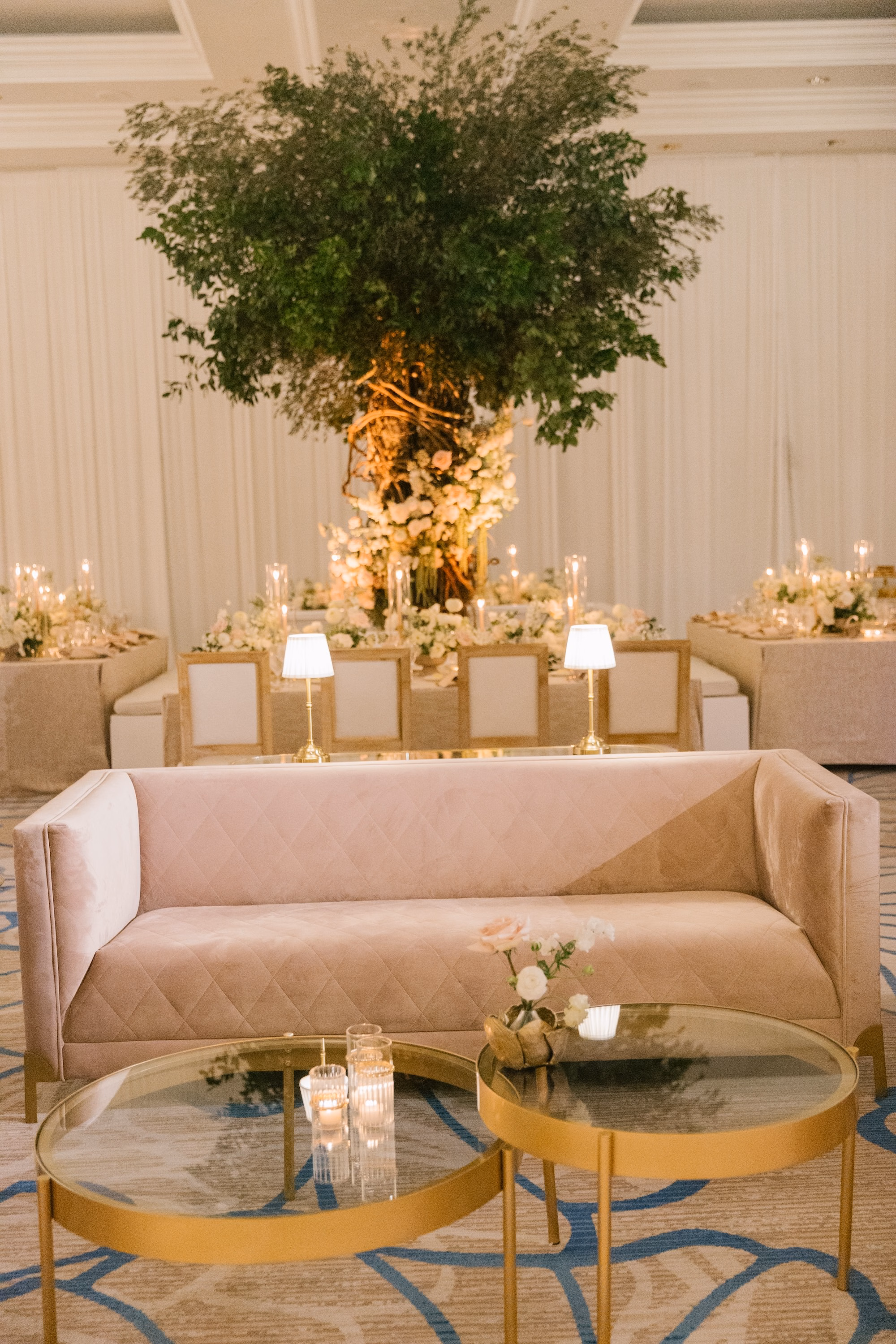 29Luxurious Romantic Garden Ballroom Wedding Inspiration - Luxurious Garden-Inspired Naples Wedding | Hyatt Regency Coconut Point Wedding Reception Lounge Area with Blush Velvet Sofa and Gold Cocktail Tables | Luxury Lounge Furniture Rental Inspiration | Greenery Tree and Candlelight Decor Ideas | Bonita Springs Venue Hyatt Regency Coconut Point | Planner Parties A’ La Carte