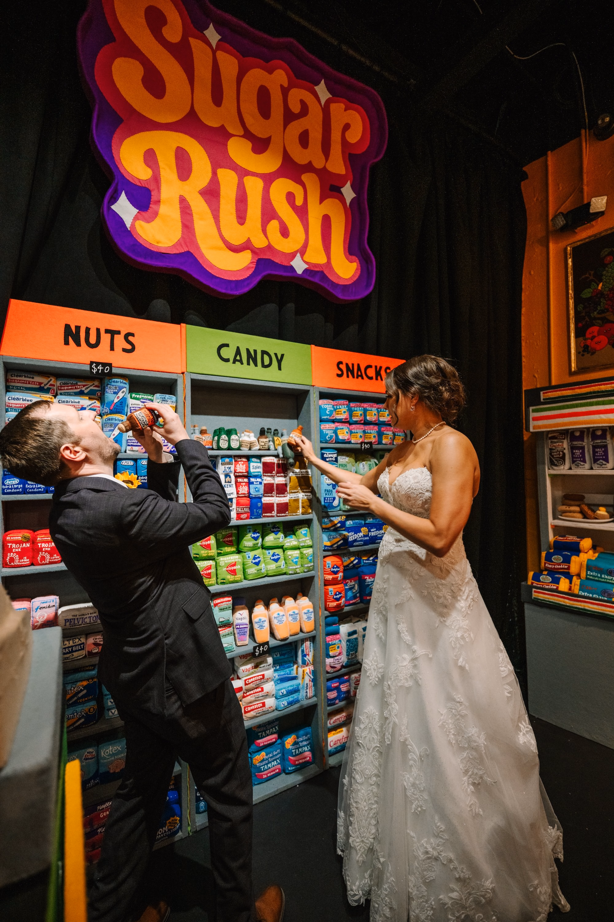 30Vibrant Disco Themed Wedding Inspiration St Pete Musuem Venue FloridaRAMA - Neon Disco Meets Old Florida St. Pete Wedding | FloridaRAMA Bride and Groom Wedding Reception Portrait | Oversized Vintage Grocery Store Art Installation Wedding Portrait St. Pete FloridaRAMA