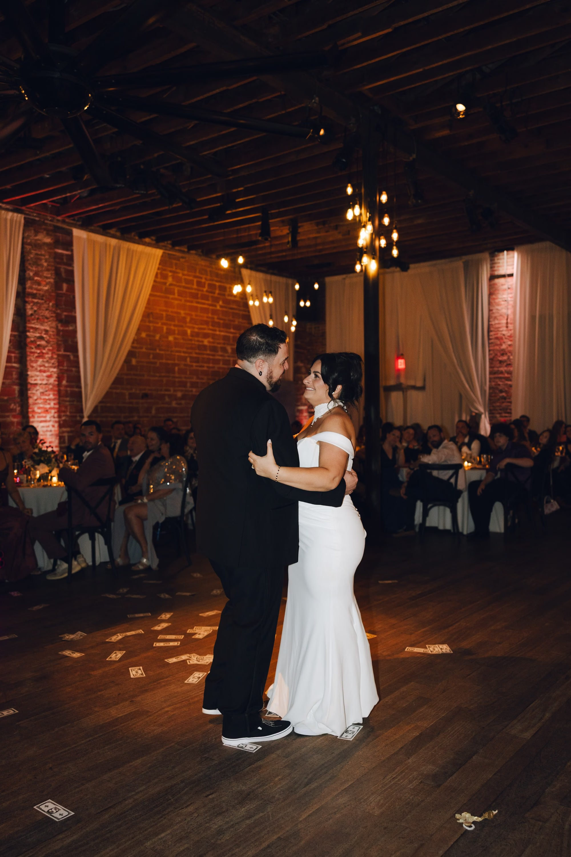 31Burgundy Vintage Romance Wedding Ideas St Pete Venue NOVA 535 - Vintage Romance Pink and Burgundy Downtown St. Pete Wedding | NOVA 535 Bride and Groom First Dance in Exposed Brick Ballroom with White Draping and String Lights | St. Pete Venue NOVA 535 | DJ Grant Hemond & Associates
