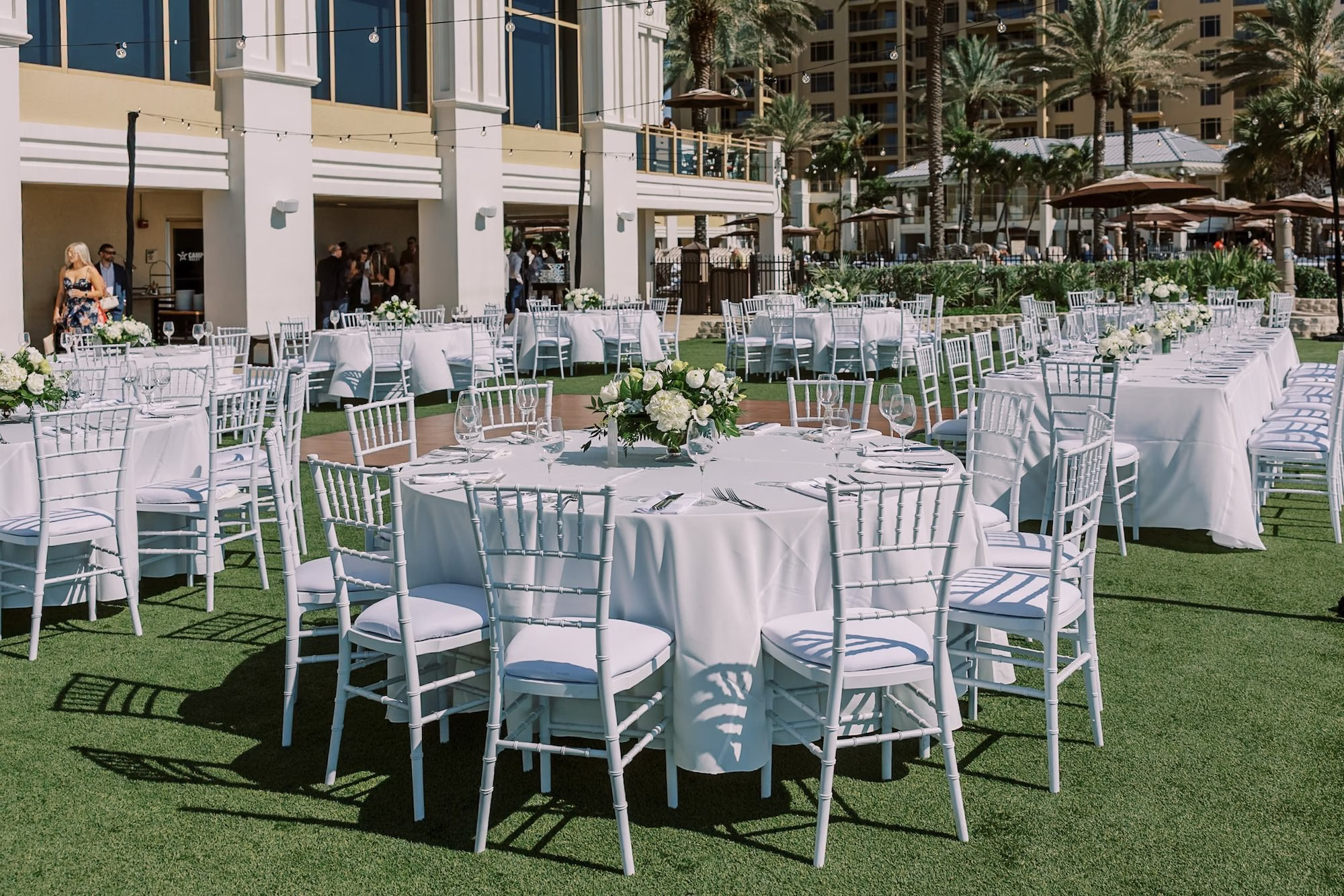 Beachfront Resort Lawn Wedding Reception with White Chiavari Chairs and White Linen Round Tables Decor Ideas | Clearwater Beach Planner Special Moments Event Planning | Rentals Gabro Event Services
