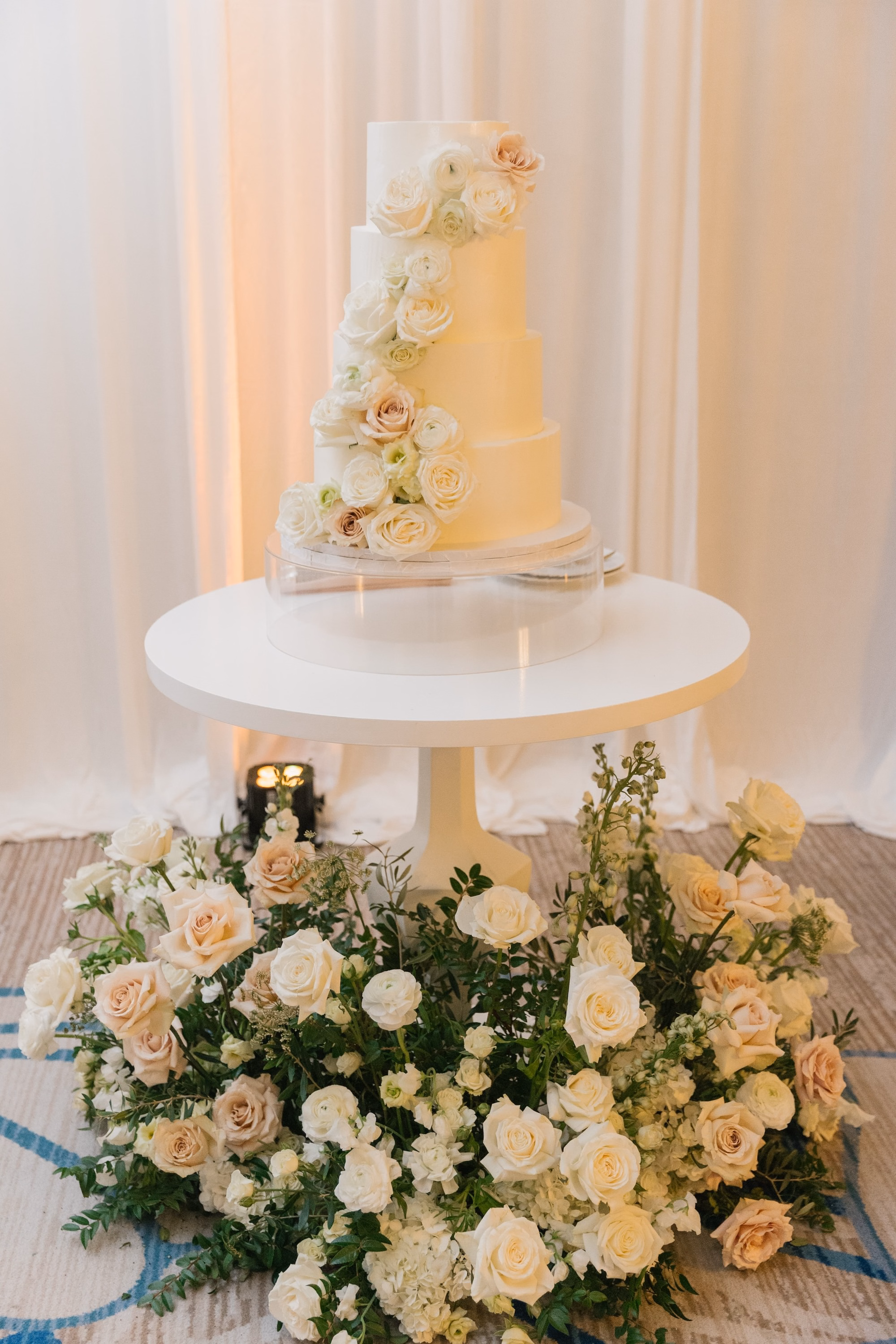 32Luxurious Romantic Garden Ballroom Wedding Inspiration - Luxurious Garden-Inspired Naples Wedding | Hyatt Regency Coconut Point Four Tier White Buttercream Wedding Cake Detail | Simple Elegant Tiered Wedding Cake Inspiration | White and Blush Floral Cake Table Decor Ideas