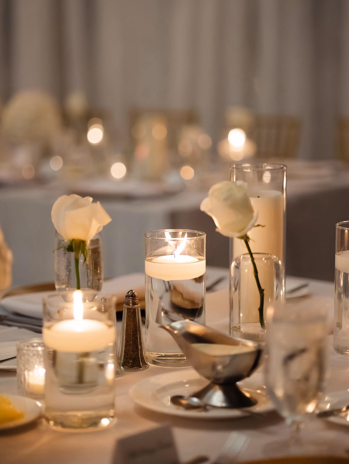 White Rose Bud Vase and Floating Candle Centerpiece on Wedding Reception Table Decor Ideas