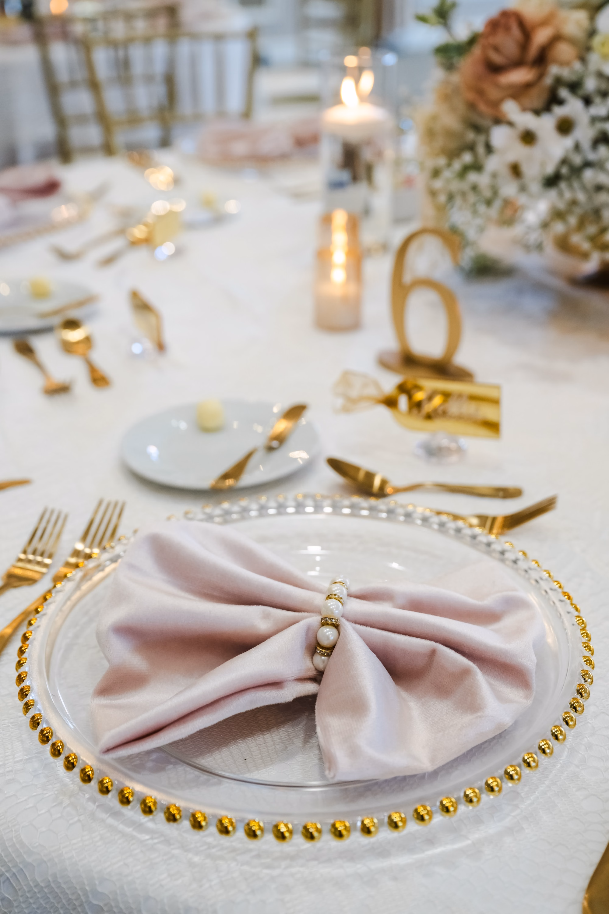 34Romantic Gold and Ivory Florida Wedding Ideas - Romantic Ivory and Gold Sarasota Wedding | Lakewood Ranch Golf & Country Club Wedding Reception Place Setting with Gold Beaded Charger, Velvet Blush Napkin and Gold Flatware Tablescape Decor Inspiration | Gold Table Number Decor Ideas