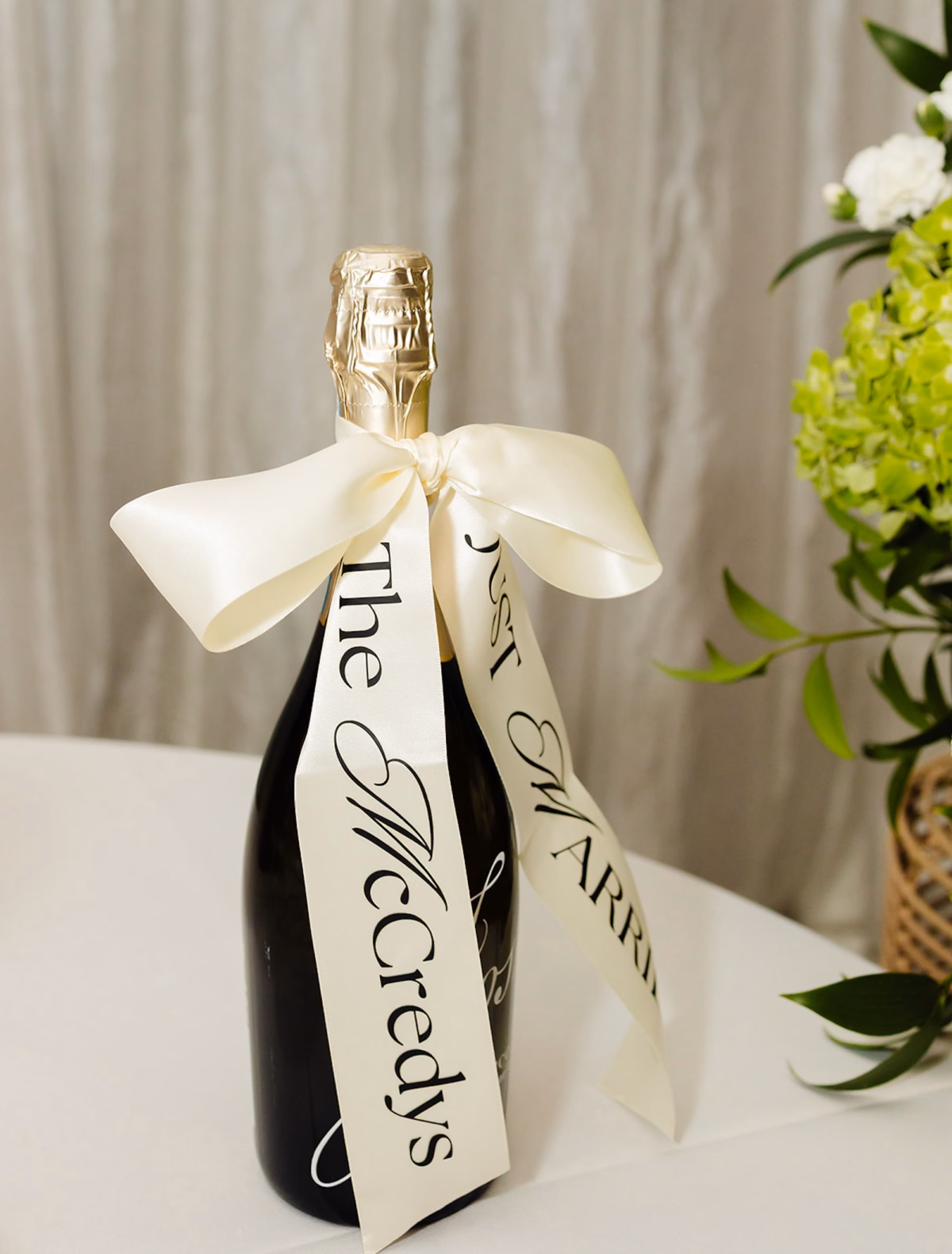 Personalized Champagne Bottle with Ivory Ribbon Reading The McCredys Wedding Ideas