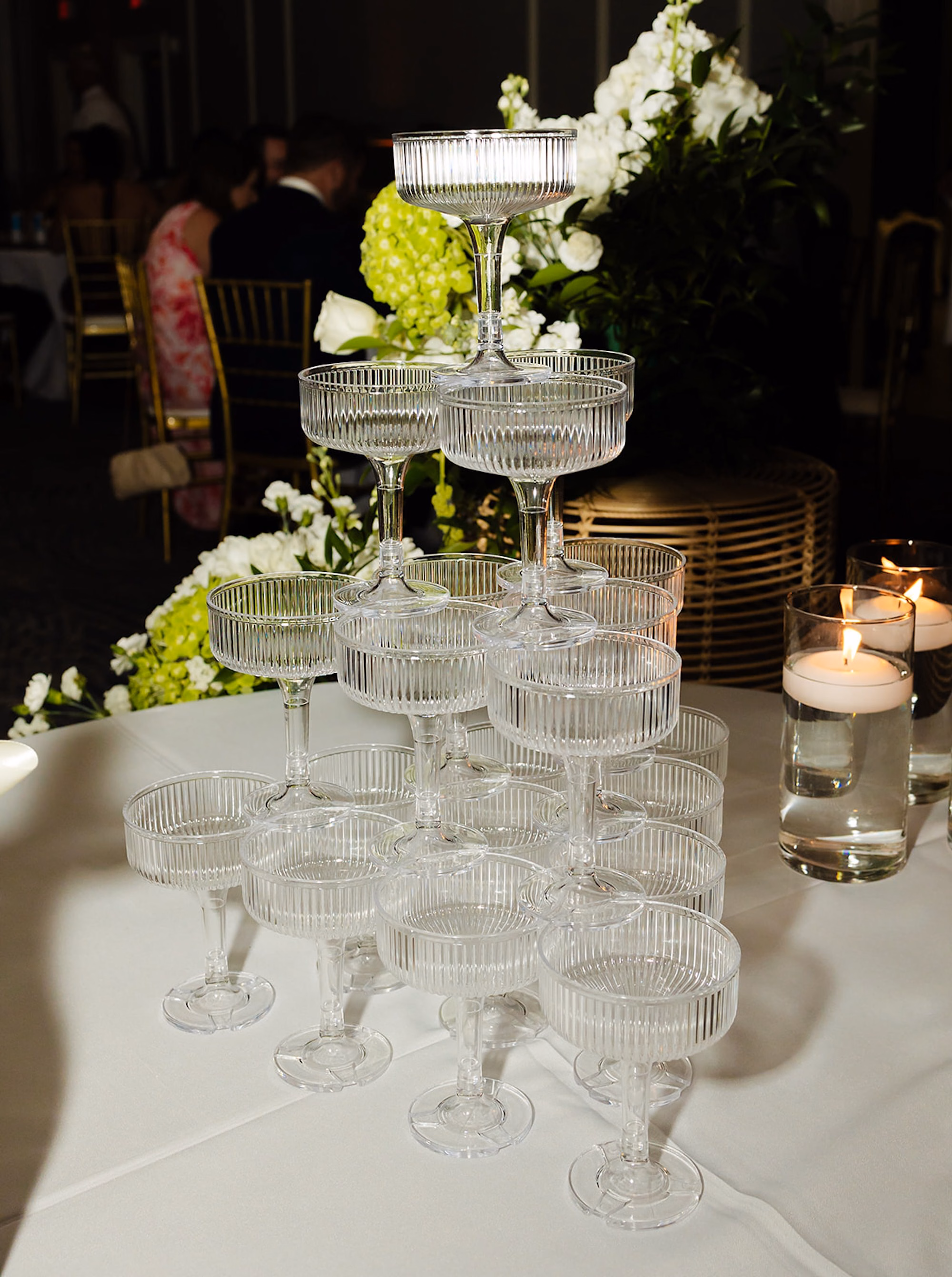 Coupe Glass Champagne Tower with White Hydrangea and Candles Wedding Reception Ideas