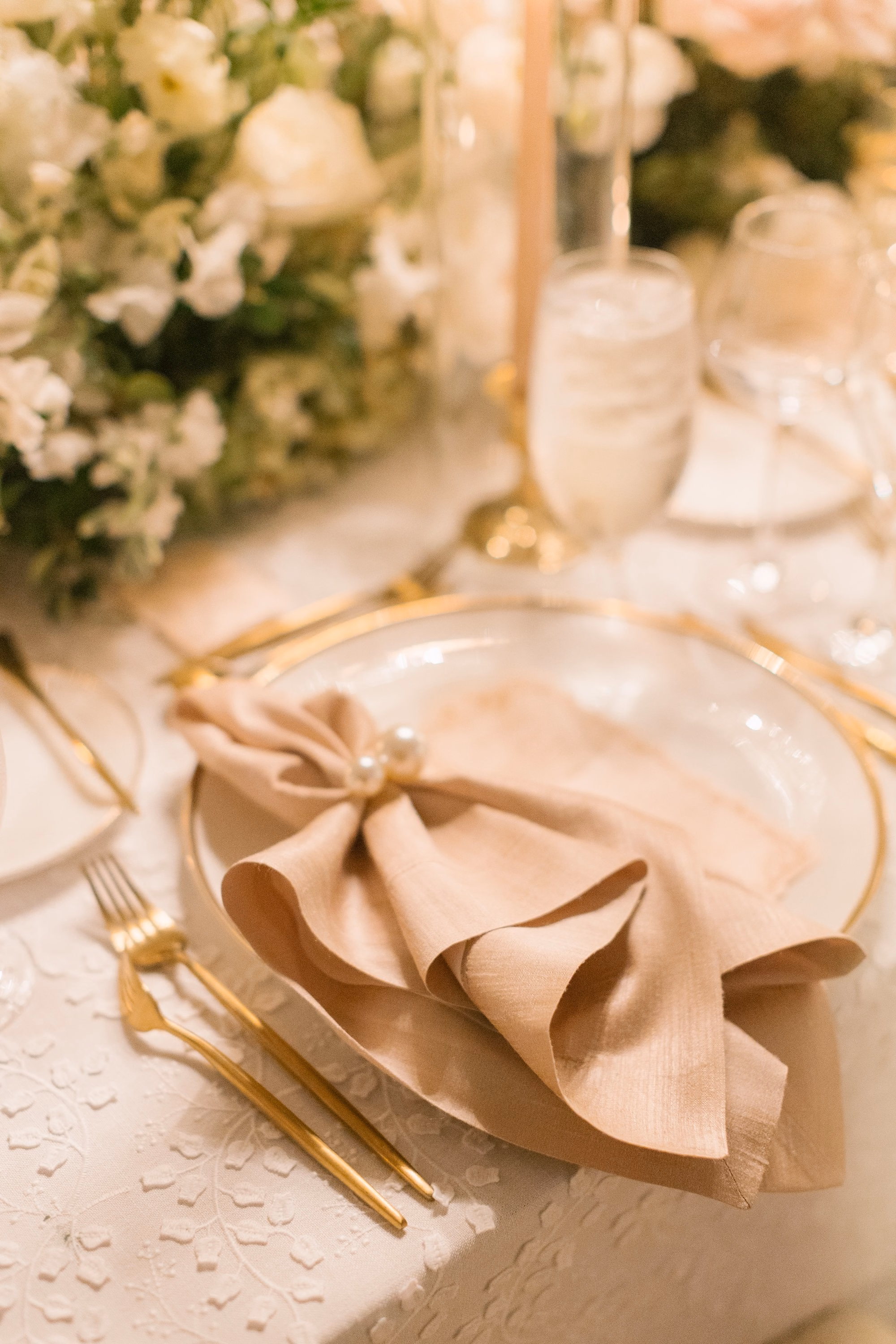 36Luxurious Romantic Garden Ballroom Wedding Inspiration - Luxurious Garden-Inspired Naples Wedding | Hyatt Regency Coconut Point Wedding Reception Place Setting Detail | Blush Bow Napkin with Gold Charger and Flatware Inspiration | Elegant Formal Tablescape Styling Ideas | Planner Parties A’ La Carte