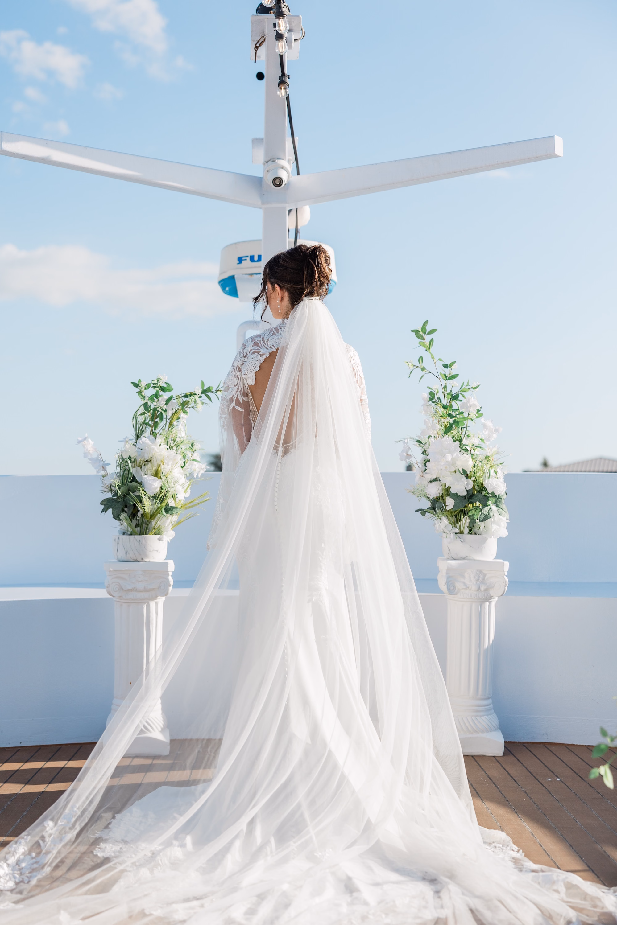 Bride on Yacht Wedding Portrait | Lace Open Back Wedding Gown Inspiration | Cathedral Length Veil Ideas | White Roses Floral Decor Arrangements Inspiration | Clearwater Venue Yacht StarShip