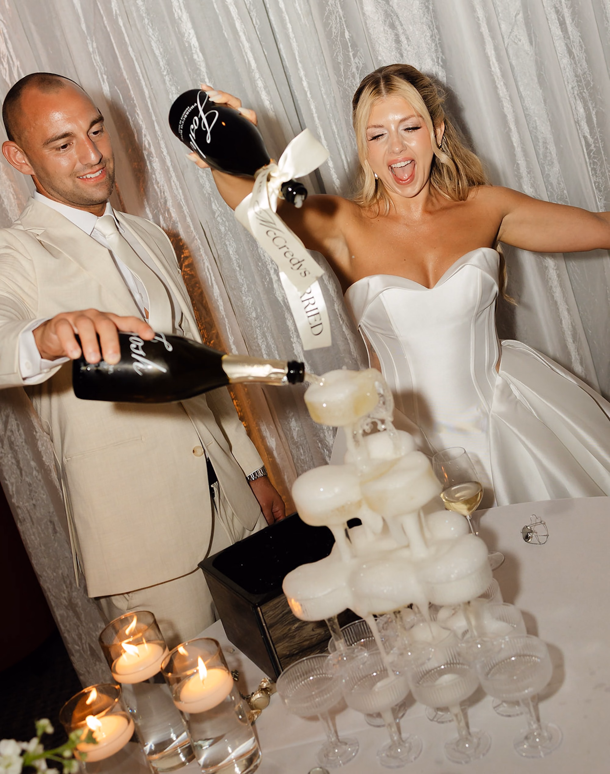 Bride and Groom Pouring Champagne Tower Together at Wedding Reception Instead of Cake Cutting Ideas