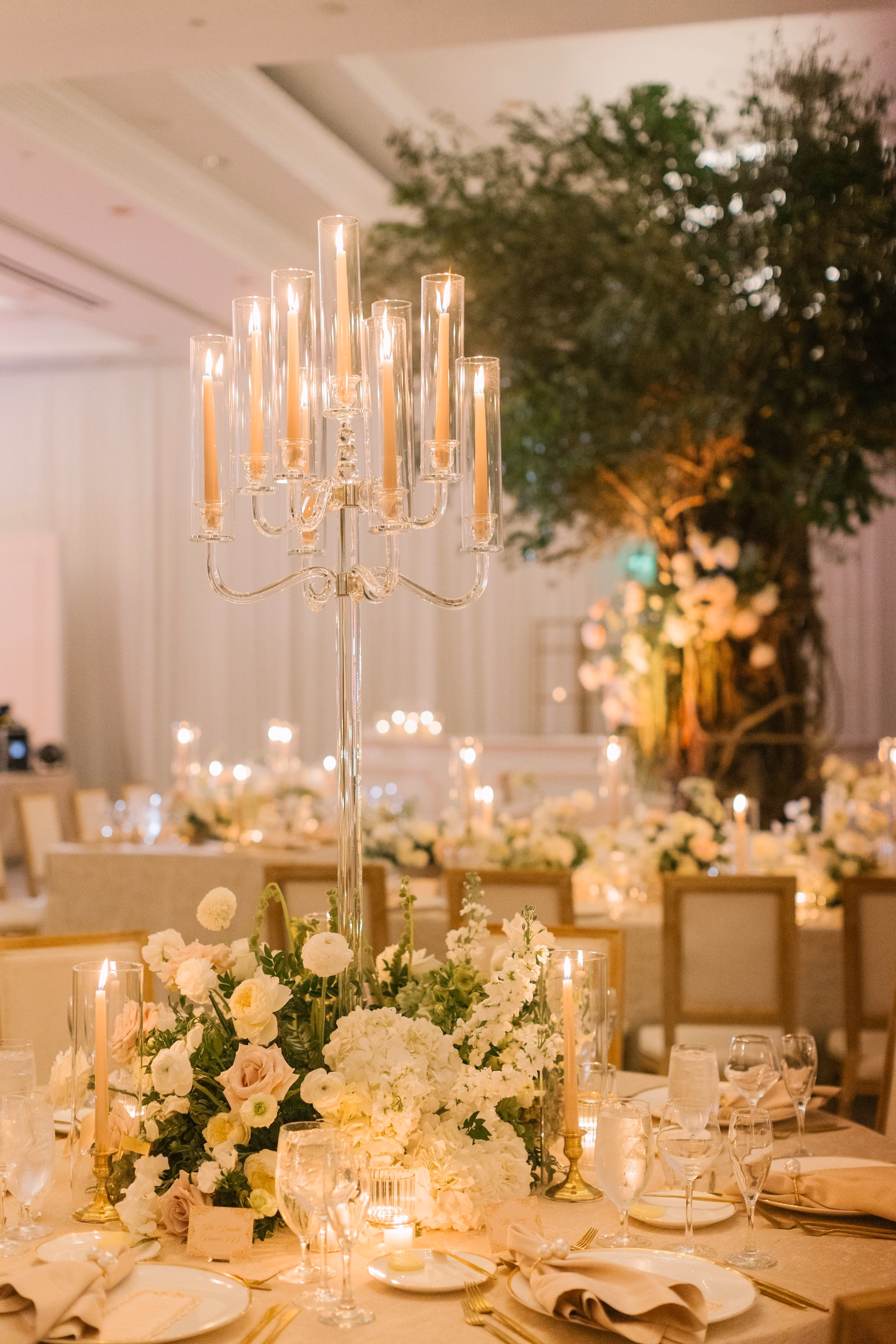 40Luxurious Romantic Garden Ballroom Wedding Inspiration - Luxurious Garden-Inspired Naples Wedding | Hyatt Regency Coconut Point Wedding Reception Table Candelabra Centerpiece Detail | Crystal Candelabra with White and Blush Florals Inspiration | Romantic Candlelit Reception Decor Ideas | Bonita Springs Venue Hyatt Regency Coconut Point | Planner Parties A’ La Carte