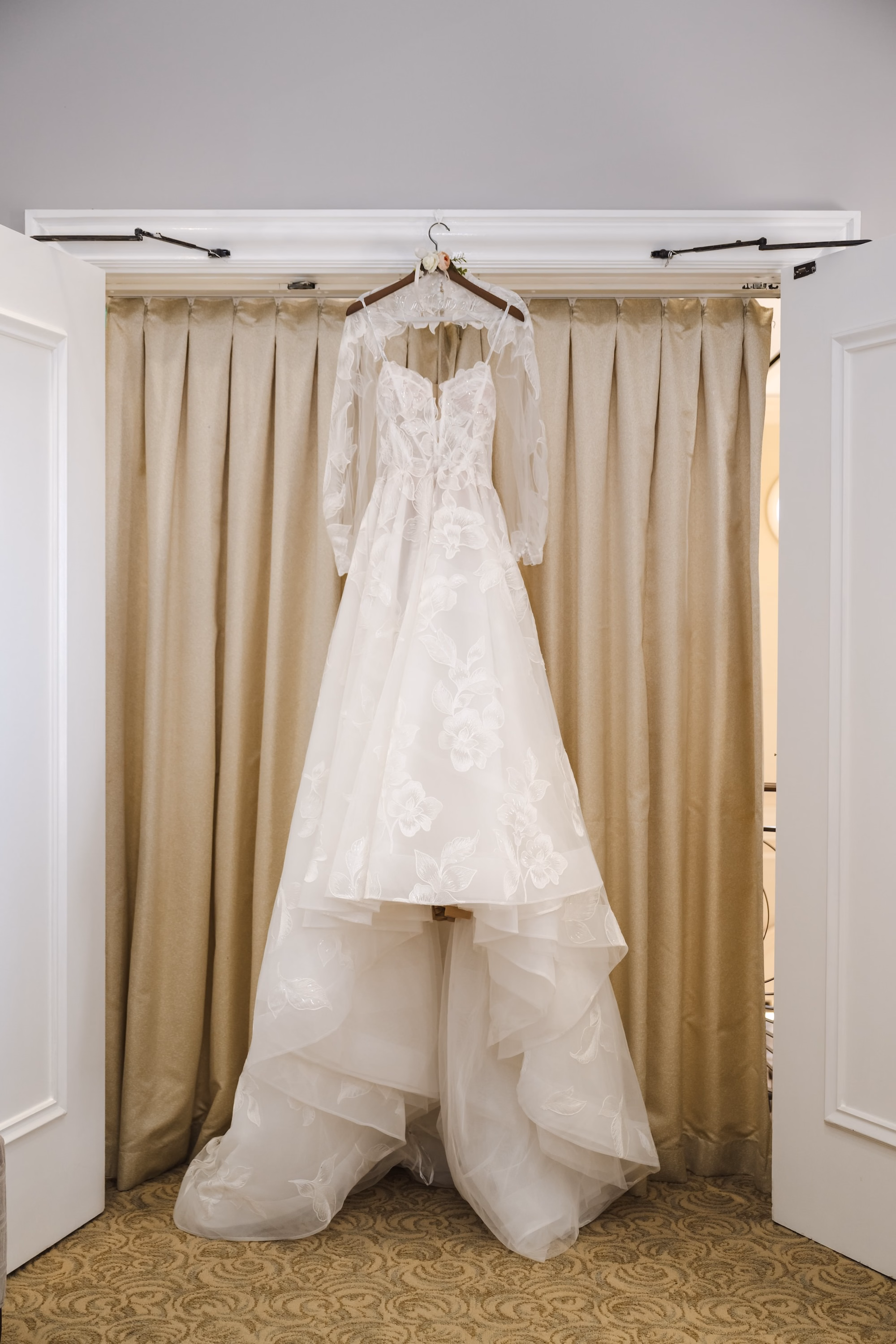 4Romantic Gold and Ivory Florida Wedding Ideas - Romantic Ivory and Gold Sarasota Wedding | Lakewood Ranch Golf & Country Club High Neck, Long Sleeve Lace Floral Wedding Ballgown hanging in Doorway Inspiration | St. Pete Wedding Photographer and Videographer Iyrus Weddings