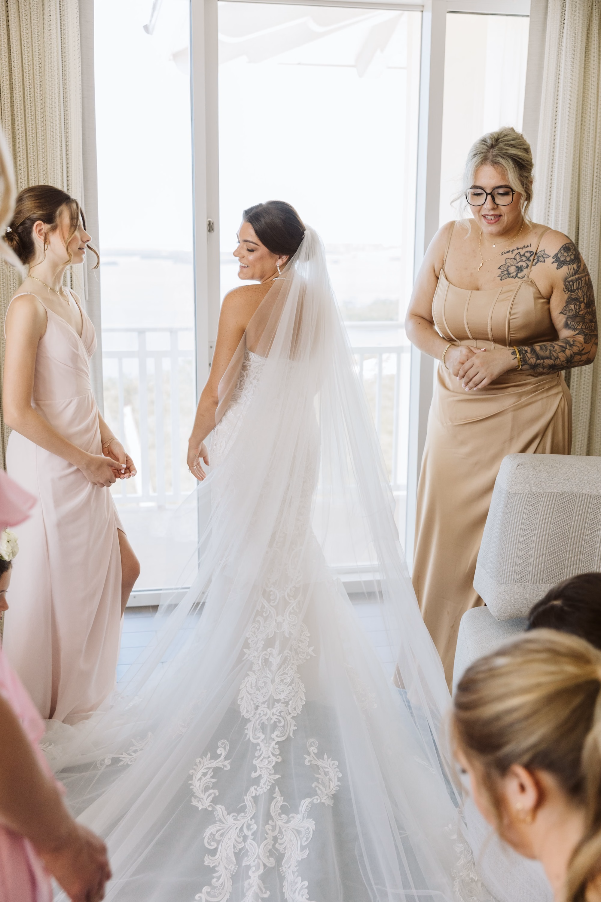 5Luxurious Romantic Garden Ballroom Wedding Inspiration - Luxurious Garden-Inspired Naples Wedding | Hyatt Regency Coconut Point Bride Getting Ready with Mother and Bridesmaid Wedding Portrait | Lace Mermaid Wedding Gown with Cathedral Length Veil Inspiration | Scalloped Lace Veil Trim Ideas