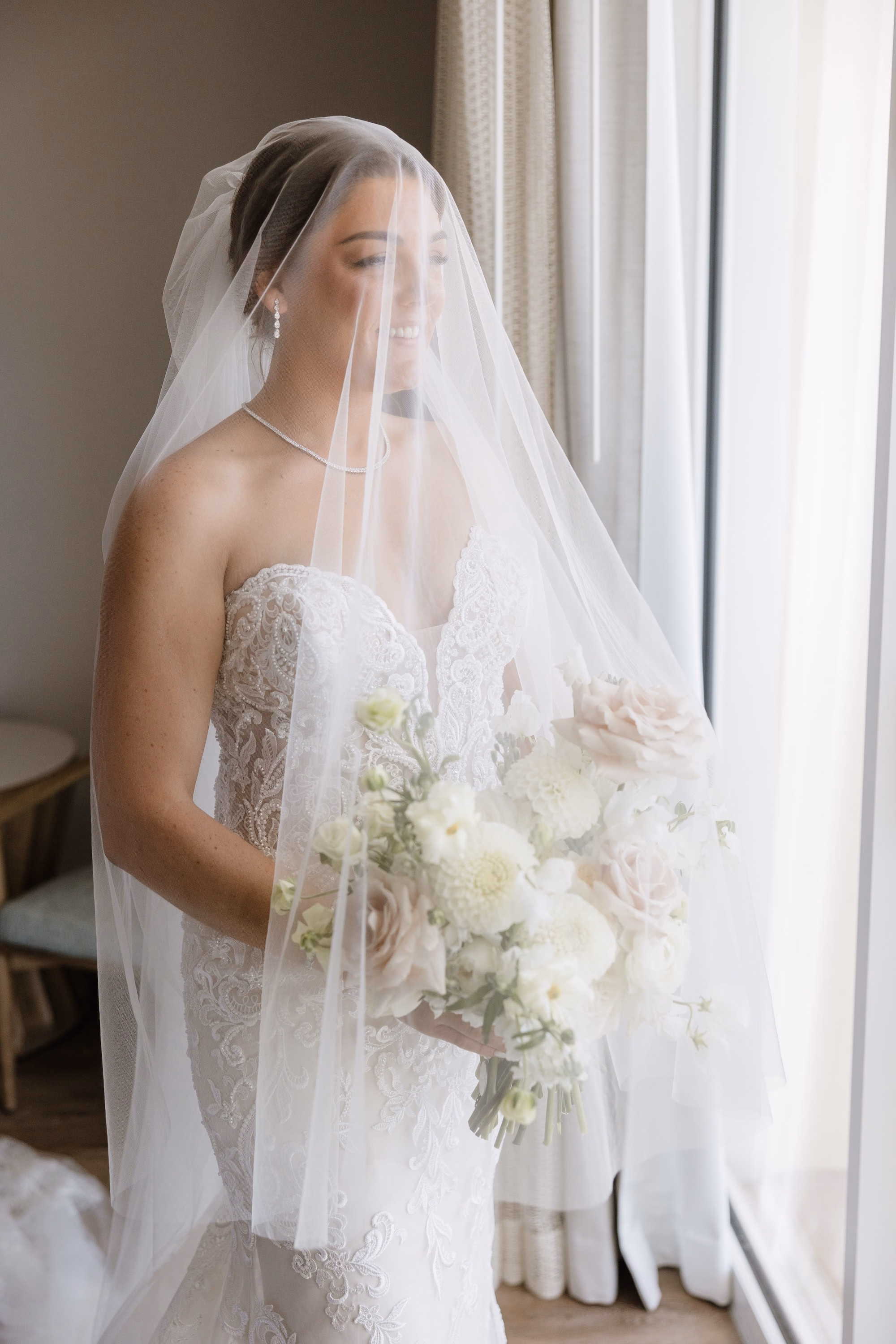 7Luxurious Romantic Garden Ballroom Wedding Inspiration - Luxurious Garden-Inspired Naples Wedding | Hyatt Regency Coconut Point Bride Under Cathedral Veil Wedding Portrait | Lace Mermaid Wedding Gown Inspiration | White and Blush Bridal Bouquet Ideas