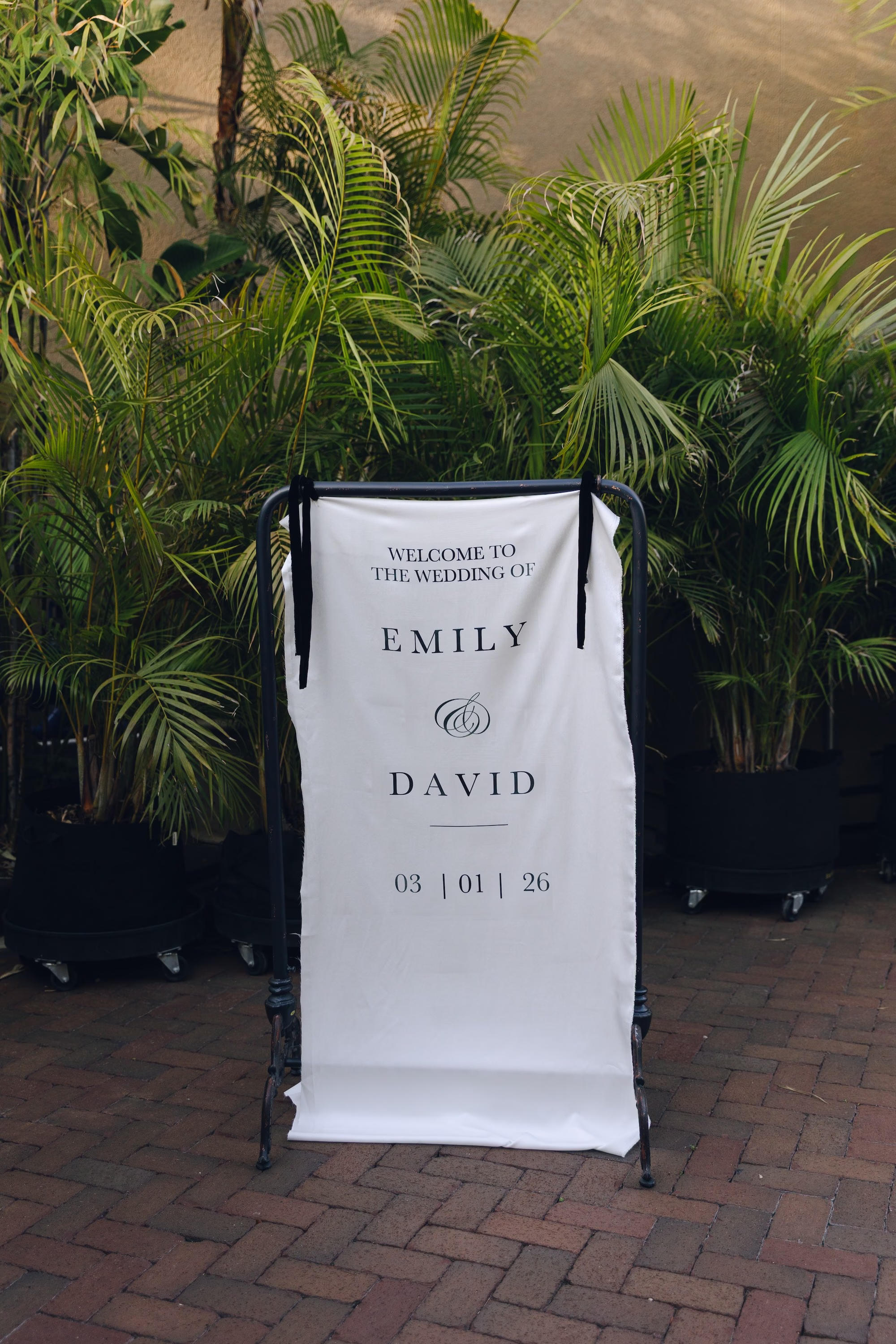 8Burgundy Vintage Romance Wedding Ideas - Vintage Romance Pink and Burgundy Downtown St. Pete Wedding | NOVA 535 Minimalist White Fabric Wedding Welcome Sign on Black Easel with Tropical Palms Ideas